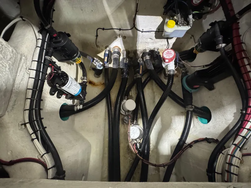 Slide: The Image of 2019 Yellowfin 26 Hybrid boat interior showing complex wiring and plumbing system. - 29