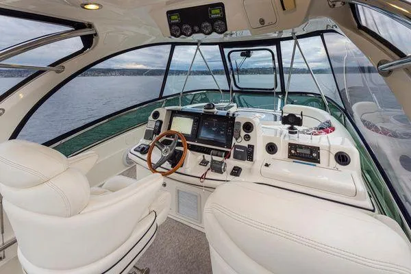 Slide: The Image of Luxurious 2005 Sea Ray 520 Sedan Bridge yacht interior with modern navigation equipment. - 19
