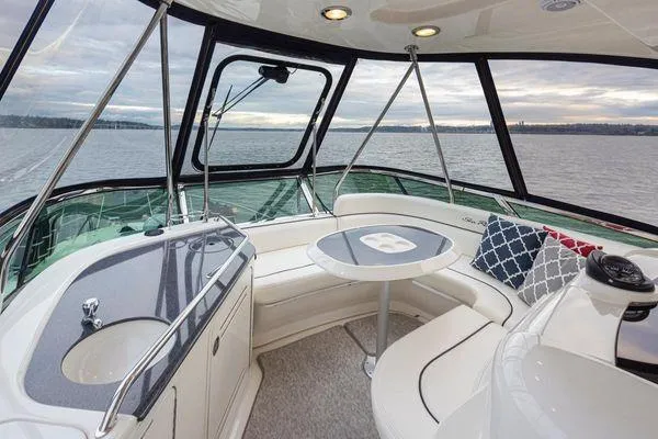 Slide: The Image of Luxurious 2005 Sea Ray 520 Sedan Bridge interior with elegant seating and scenic water view. - 26