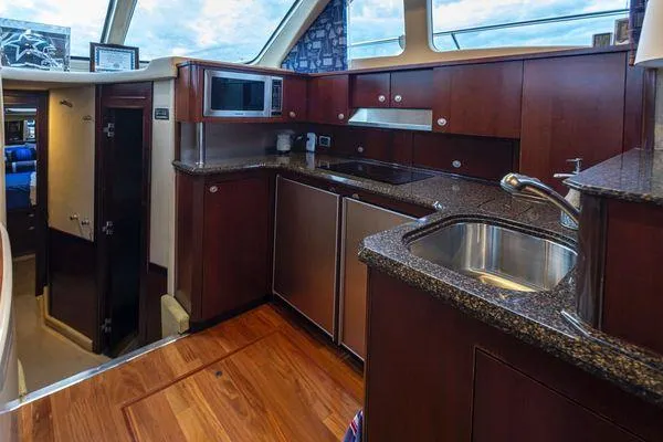 Slide: The Image of Luxurious kitchen interior of 2005 Sea Ray 520 Sedan Bridge yacht. - 35