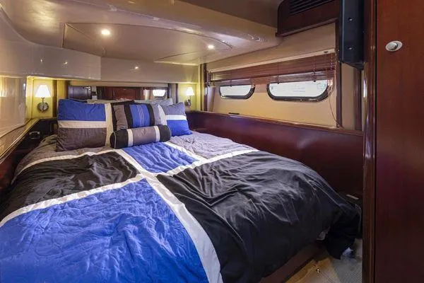 Slide: The Image of Luxurious bedroom interior of 2005 Sea Ray 520 Sedan Bridge yacht with modern bedding. - 40