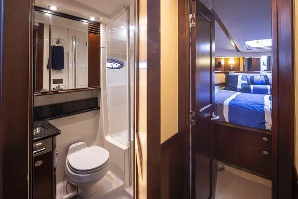 Slide: The Image of Luxurious 2005 Sea Ray 520 Sedan Bridge yacht interior with bathroom and bedroom. - 45