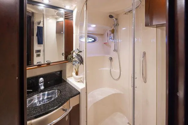 Slide: The Image of Luxurious bathroom in 2005 Sea Ray 520 Sedan Bridge yacht with modern fixtures and elegant design. - 48