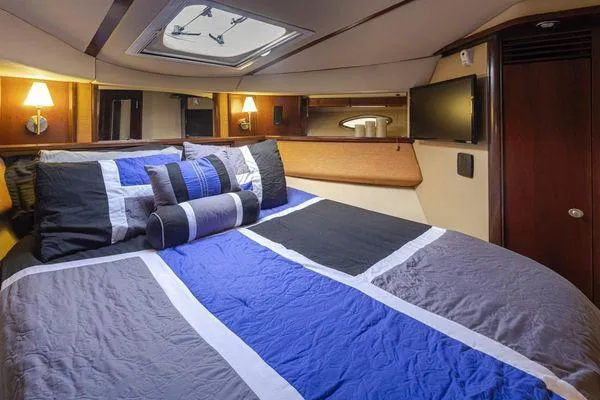 Slide: The Image of Luxurious 2005 Sea Ray 520 Sedan Bridge bedroom with modern decor and ambient lighting. - 49