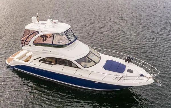 Slide: The Image of 2005 Sea Ray 520 Sedan Bridge yacht on calm water, aerial view. - 7