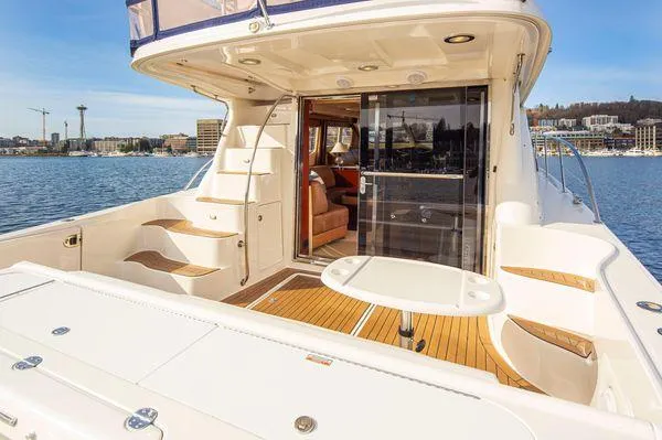 Slide: The Image of 2005 Sea Ray 520 Sedan Bridge yacht with spacious deck and elegant interior. - 9