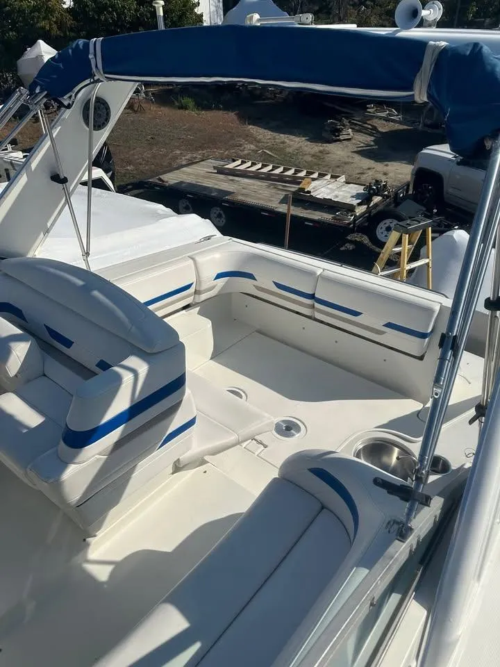 Slide: The Image of 2002 Formula 31 PC boat with blue accents and spacious seating area. - 1