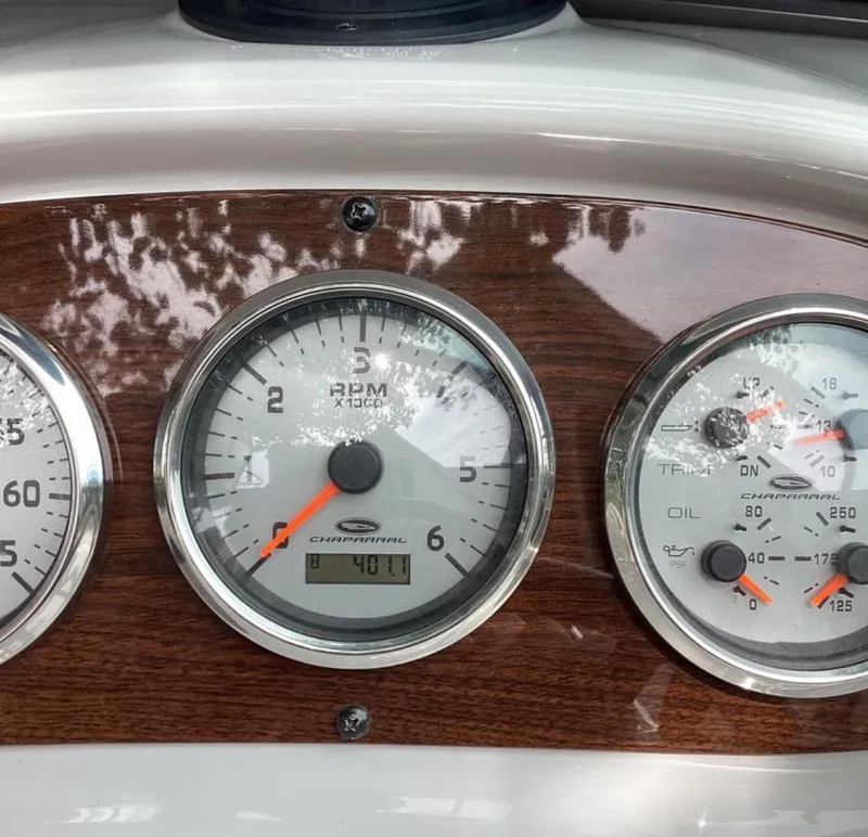 Slide: The Image of Dashboard gauges of a 2007 Chaparral 204 SSi boat, featuring RPM and oil indicators. - 14