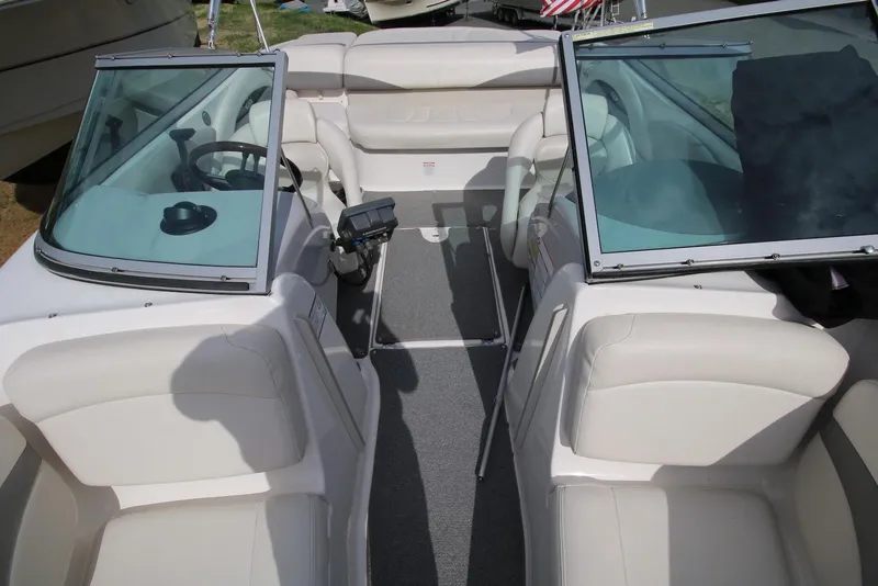 Slide: The Image of 2007 Chaparral 204 SSi boat interior with beige seating and dual windshields. - 16