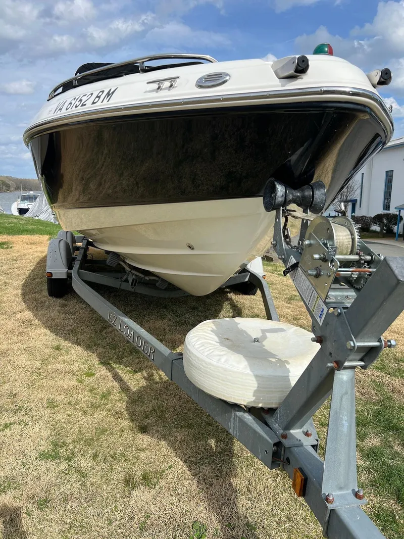 Slide: The Image of 2007 Chaparral 204 SSi boat on trailer, parked on grass under a cloudy sky. - 17