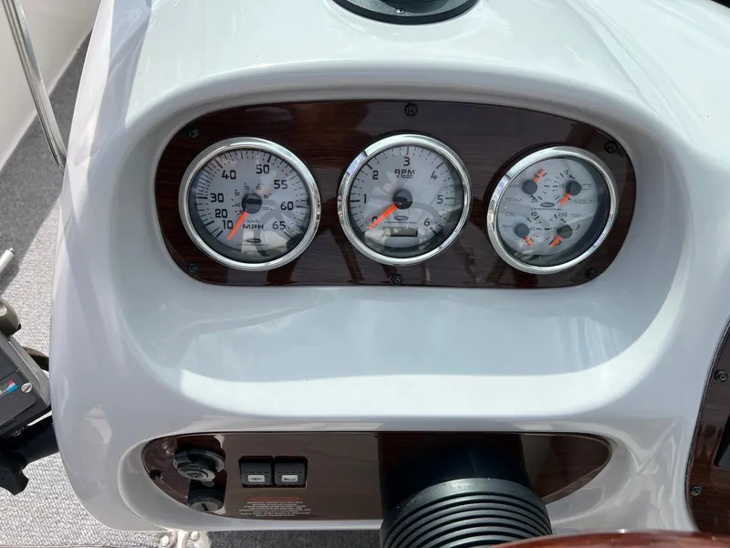 Slide: The Image of Dashboard of a 2007 Chaparral 204 SSi boat with speedometer and gauges. - 18