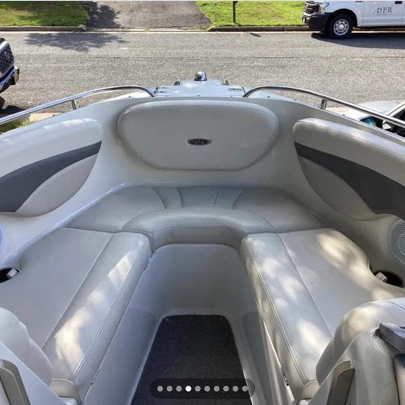 Slide: The Image of 2007 Chaparral 204 SSi boat interior with white seating and sleek design. - 19