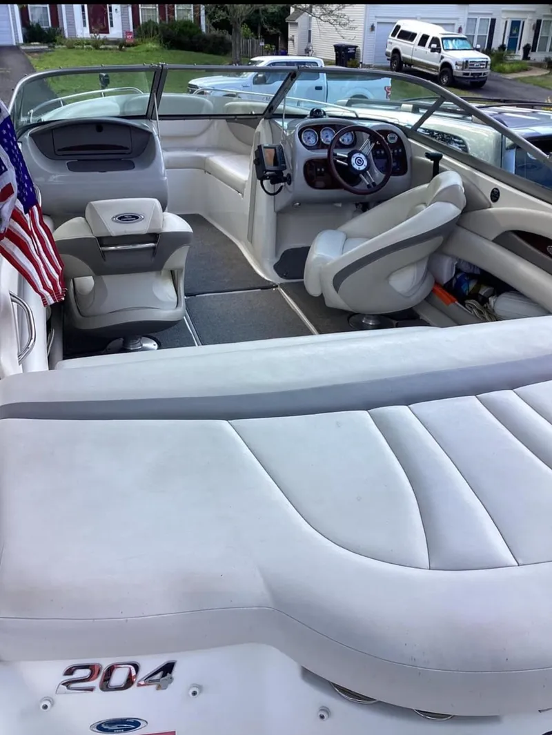 Slide: The Image of 2007 Chaparral 204 SSi boat interior with seating, steering wheel, and American flag. - 3