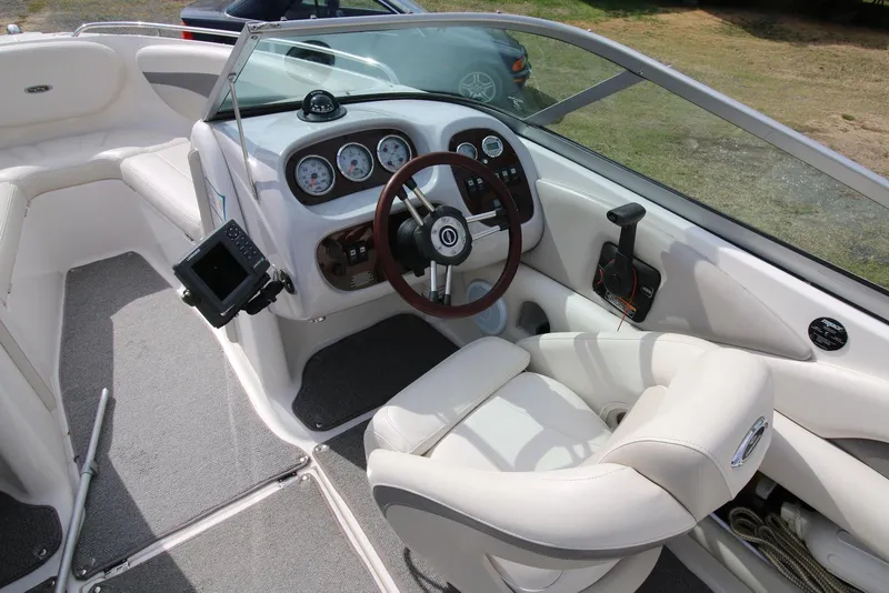Slide: The Image of 2007 Chaparral 204 SSi boat interior with steering wheel and dashboard controls. - 5