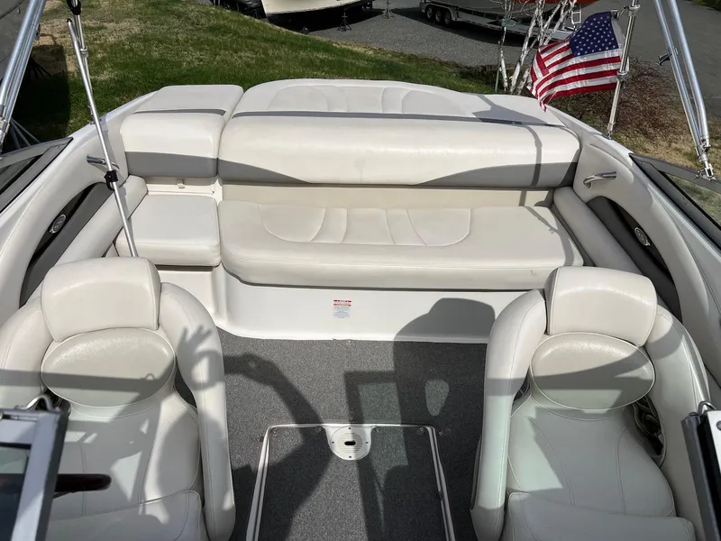 Slide: The Image of 2007 Chaparral 204 SSi boat interior with white seating and American flag. - 6