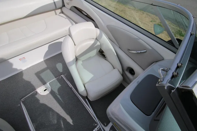 Slide: The Image of 2007 Chaparral 204 SSi boat interior with white seating and gray flooring. - 8