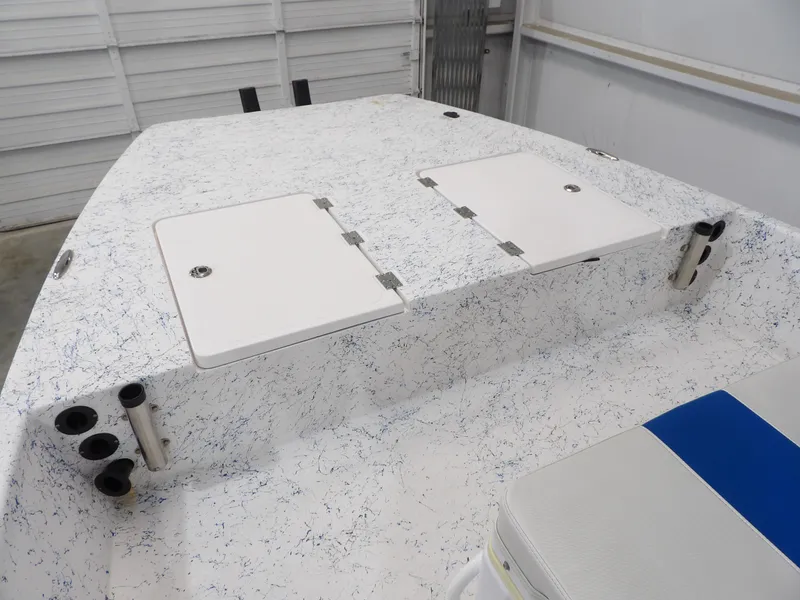 Slide: The Image of 2022 Freedom 18 PATRIOT boat deck with storage hatches and rod holders. - 12