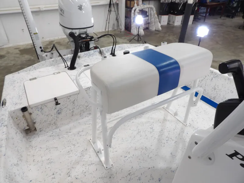 Slide: The Image of 2022 Freedom 18 PATRIOT boat interior with white and blue seating, Suzuki outboard motor. - 15