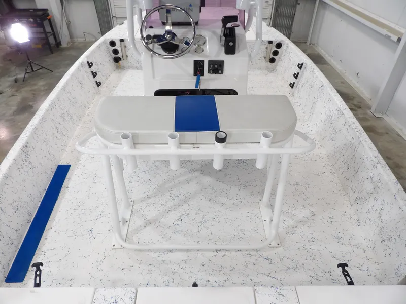 Slide: The Image of 2022 Freedom 18 PATRIOT boat interior with steering wheel and seating. - 18