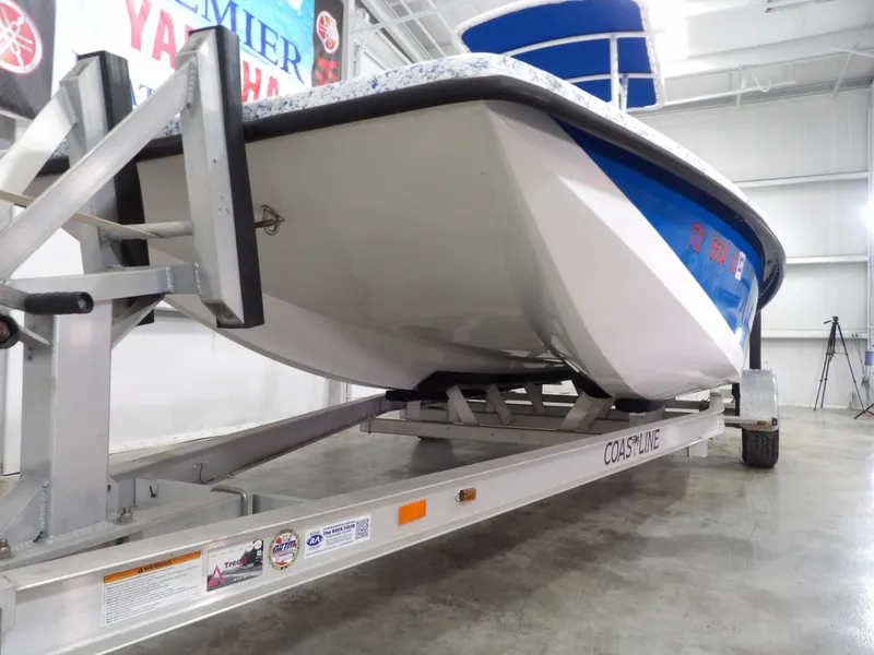 Slide: The Image of 2022 Freedom 18 PATRIOT boat on trailer in indoor showroom. - 5