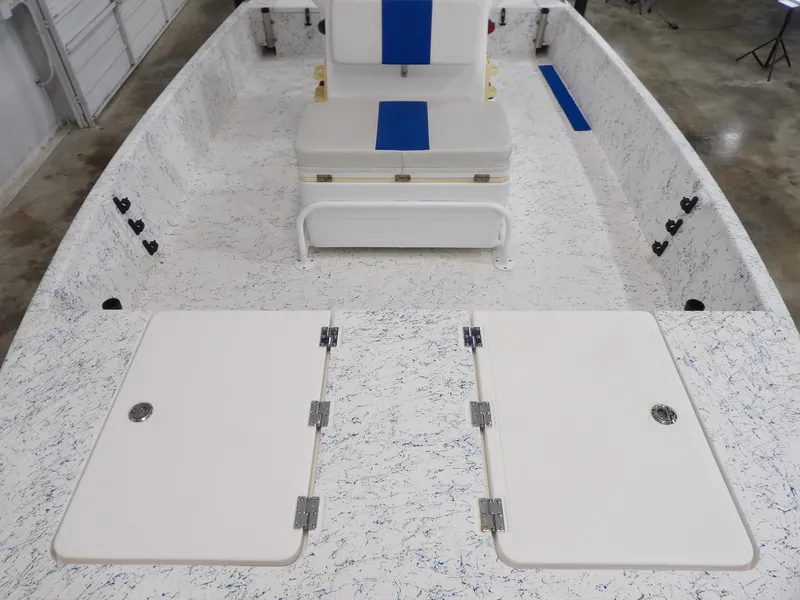 Slide: The Image of 2022 Freedom 18 PATRIOT boat interior with white and blue seating, storage compartments. - 9