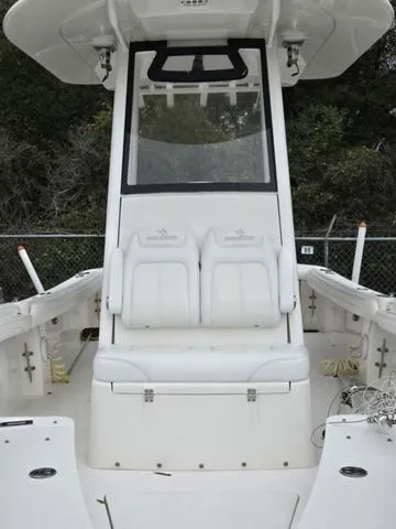 Slide: The Image of 2020 Regulator 23 boat with white seating and center console design. - 5