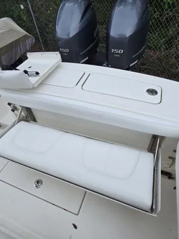 Slide: The Image of 2020 Regulator 23 boat with dual 150 horsepower engines and foldable seating. - 8