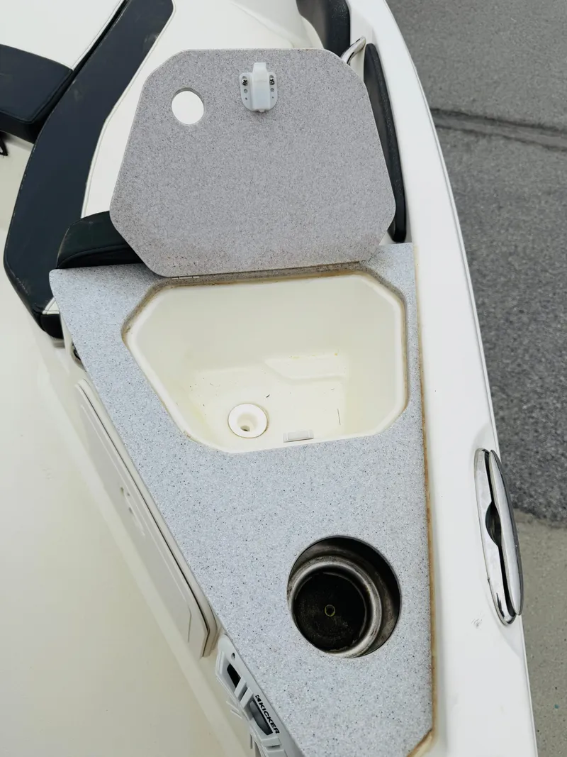 Slide: The Image of Open storage compartment on 2019 Stingray 206 CC boat deck. - 5