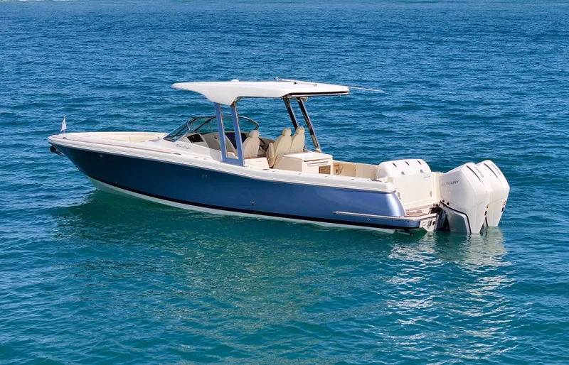 Slide: The Image of 2022 Chris-Craft Calypso 30 boat on clear blue water. - 1