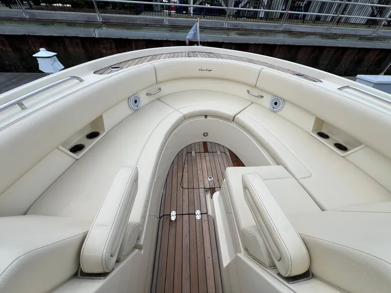 Slide: The Image of 2022 Chris-Craft Calypso 30 boat with elegant cream seating and teak flooring. - 9