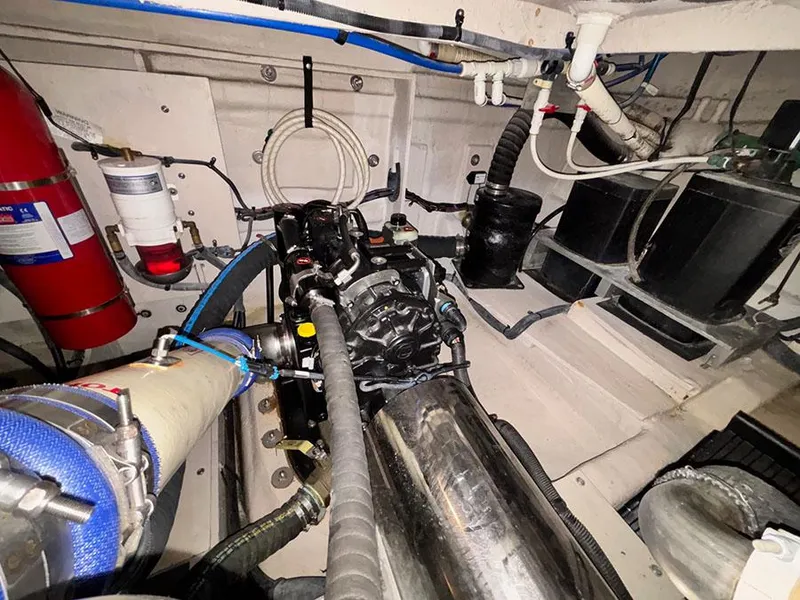 Slide: The Image of Engine room of 2013 Sea Ray 450 Sedan Bridge with visible components and fire extinguisher. - 22