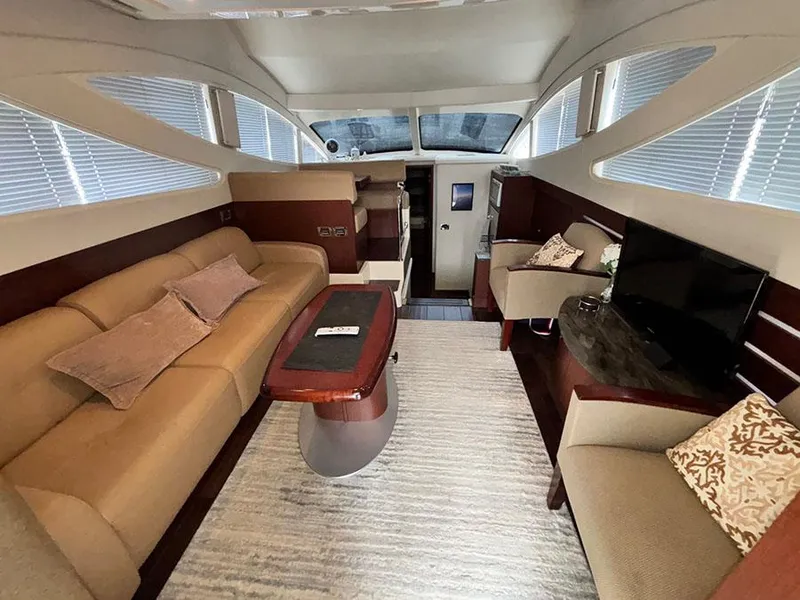 Slide: The Image of Luxurious interior of 2013 Sea Ray 450 Sedan Bridge yacht with elegant seating and modern amenities. - 25