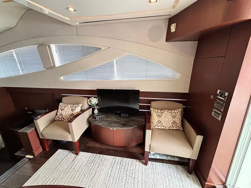 Slide: The Image of Luxurious interior of 2013 Sea Ray 450 Sedan Bridge with elegant seating and modern decor. - 27