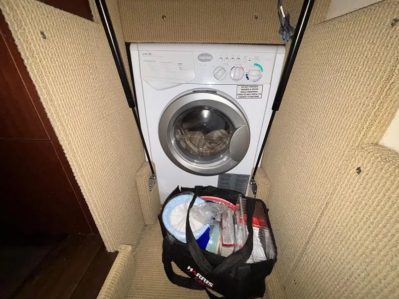Slide: The Image of Washing machine inside 2013 Sea Ray 450 Sedan Bridge yacht with storage bag. - 32