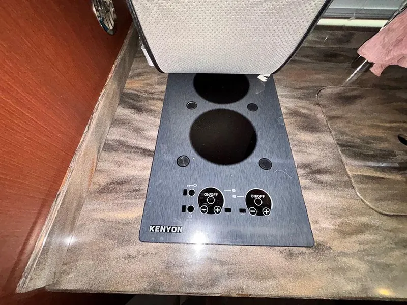 Slide: The Image of Kenyon stove on 2013 Sea Ray 450 Sedan Bridge yacht kitchen countertop. - 35