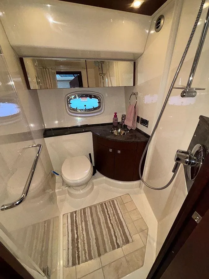Slide: The Image of Luxurious bathroom in 2013 Sea Ray 450 Sedan Bridge yacht with modern fixtures. - 42