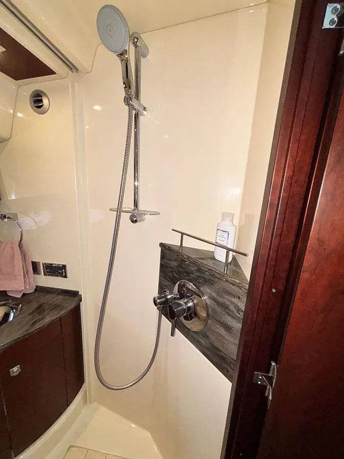Slide: The Image of Shower area in 2013 Sea Ray 450 Sedan Bridge yacht, featuring modern fixtures and sleek design. - 43
