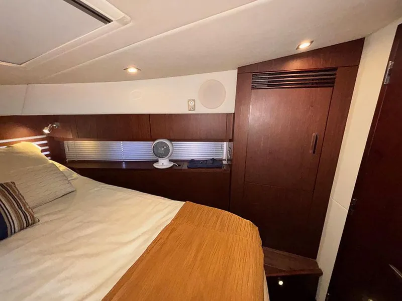 Slide: The Image of Luxurious cabin interior of 2013 Sea Ray 450 Sedan Bridge yacht with modern wood finishes. - 47