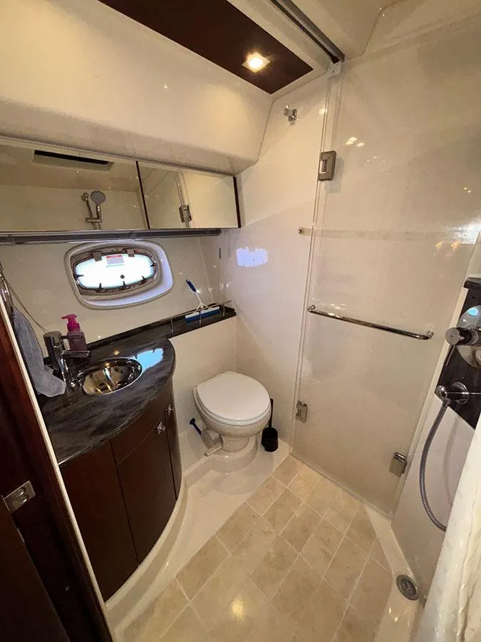 Slide: The Image of Luxurious bathroom in 2013 Sea Ray 450 Sedan Bridge yacht with modern fixtures and elegant design. - 49