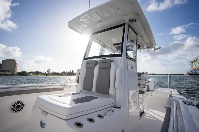 Slide: The Image of 2025 Caymas 291 HB boat on water, featuring sleek design and modern seating. - 21