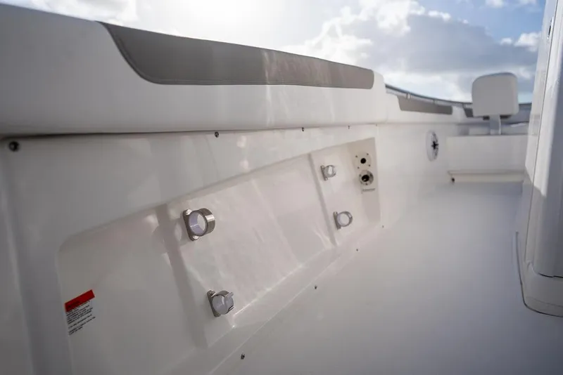 Slide: The Image of 2025 Caymas 291 HB boat interior with sleek white design and modern fittings. - 9
