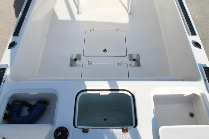 Slide: The Image of 2018 Andros 26 Tarpon boat interior with storage compartments and utility features. - 10