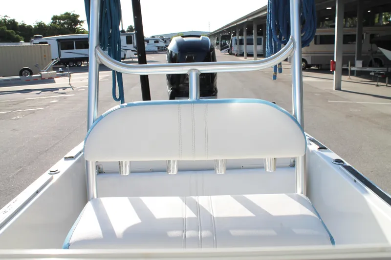 Slide: The Image of 2018 Andros 26 Tarpon boat interior with white seating and metal frame. - 18