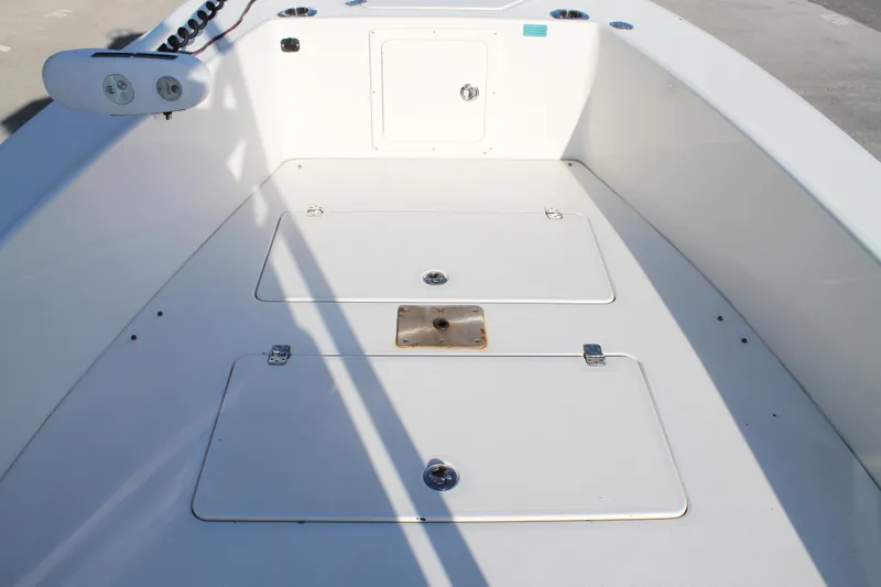 Slide: The Image of 2018 Andros 26 Tarpon boat deck with storage compartments and clean white finish. - 23