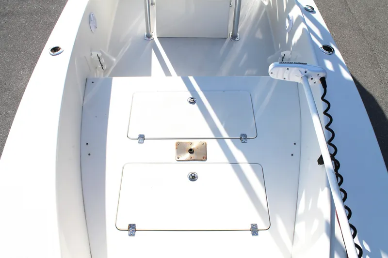 Slide: The Image of 2018 Andros 26 Tarpon boat deck with storage compartments and trolling motor. - 25
