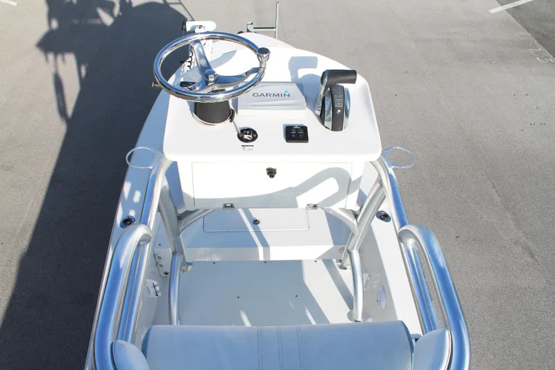 Slide: The Image of 2018 Andros 26 Tarpon boat helm with Garmin navigation system and steering wheel. - 32
