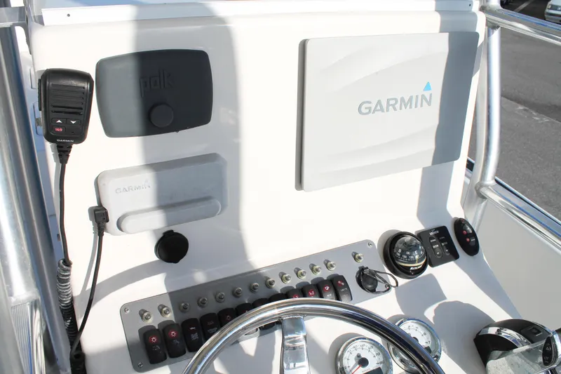 Slide: The Image of 2018 Andros 26 Tarpon boat dashboard with Garmin navigation and Polk audio system. - 33