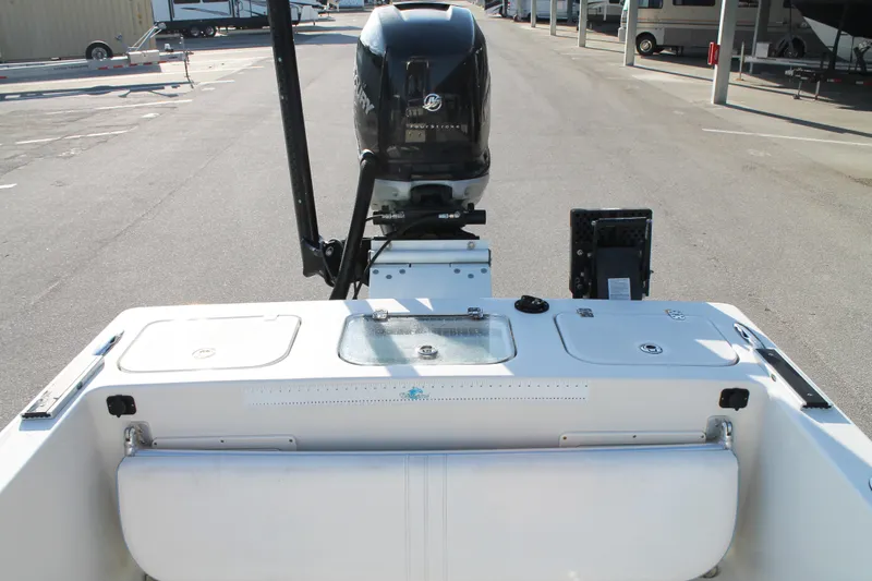 Slide: The Image of 2018 Andros 26 Tarpon boat with outboard motor in a parking area. - 9