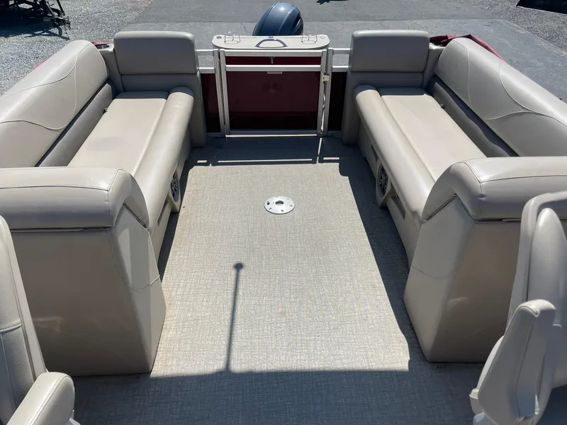 Slide: The Image of 2021 Avalon GS Quad Lounger boat interior with beige seating and spacious layout. - 14