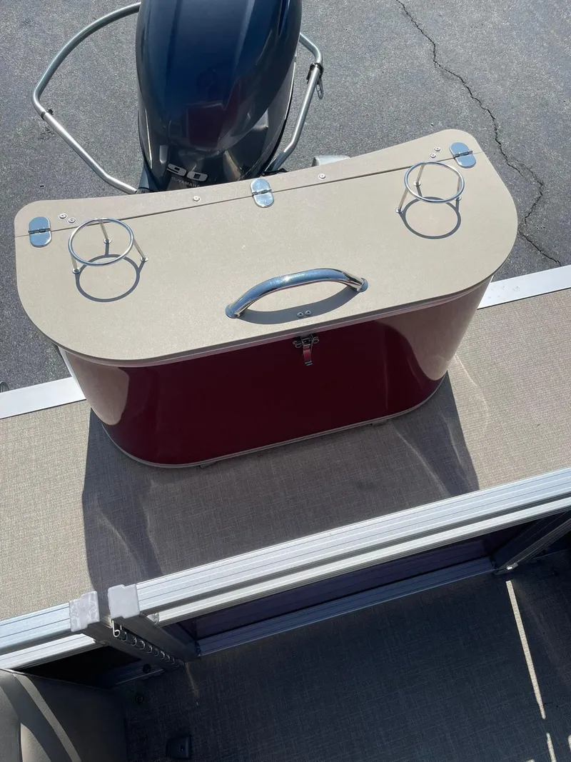 Slide: The Image of 2021 Avalon GS Quad Lounger boat with storage compartment and cup holders. - 15